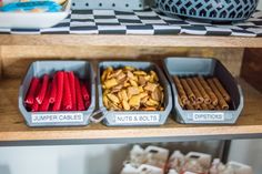 three trays filled with different types of food