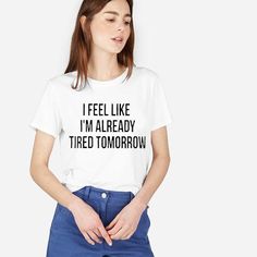 I Feel Like I’m Already Tired Tomorrow (Don’t We All Btw Lol) Crewneck Short Sleeves Ring Spun, Preshrunk 100% Cotton Double Needle Stitched Sleeve And Hem Semi-Fitted Unisex Sizing Size Up For A Looser, Slouchy Fit Other Colors Available For Shirt And Design *Each Hoodie, Sweatshirt Or T-Shirt Is Custom Made And Made To Order. *Add To Bundle Or Comment If You Would Like A Different Color Or A Custom Design On The Back. *Ask Any Questions Prior To Ordering *Offers Welcome* *If You’re New To Posh White Quote Print T-shirt For Summer, Trendy Cotton T-shirt With Quote Print, Trendy Short Sleeve Tops With Quote Print, Trendy Quote Print Crew Neck T-shirt, Summer Crew Neck T-shirt With Quote Print, White Graphic Tee With Quote Print, Trendy White T-shirt With Text Print, Trendy Slogan T-shirt For Everyday, Summer Graphic Tee With Quote Print