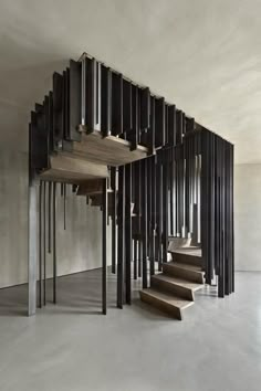 the staircase is made out of metal rods