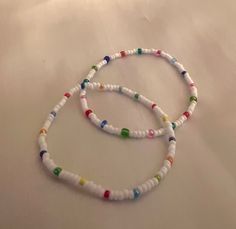 This listing is for one beaded boho bracelet. This bracelet has dainty beads that are strung on strong elastic. The primary color is an opaque white bead, while colored beads are patterned throughout as well. The bracelets are double knotted and glued shut. This bracelet would be a cute friendship bracelet, gift for a best friends, or a gift for her. Cute Friendship, Cute Friendship Bracelets, Boho Bracelet, White Beads, Boho Bracelets, Friendship Bracelet, Bracelet Gift, Primary Color, Beaded Bracelet