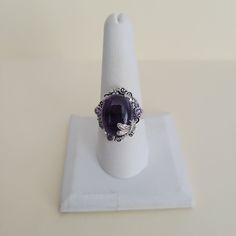 -This auction is for the following item -- Artisan Crafted Amethyst Dragonfly 925 Sterling Silver Ring (Size 9) 12.00 Cts BRAND NEW NEVER WORN IN THE BOX Shipping Options: Domestic Shipping Options (United States Only) First Class Mail Bubble Envelope w/Delivery Confirmation (about 3-5 days): FREE US Priority Mail w/Delivery Confirmation (about 2-5 days): $6.50 ALL ORDERS ARE SHIPPED SAME DAY OR 1-2 BUSINESS DAYS AFTER RECEIVING CLEARED PAYMENT     I WILL ONLY SHIP THIS TO THE USA NO INTERNATION Adjustable Purple Amethyst Ring With Stone Setting, Adjustable Hallmarked Purple Rings, Silver Cabochon Amethyst Ring, Purple Ring Stamped 925, Adjustable Silver Amethyst Ring With Stone Setting, Adjustable Amethyst Ring For Formal Occasions, Adjustable Nickel-free Purple Ring, Elegant Purple Nickel-free Rings, Silver Amethyst Ring Collectible