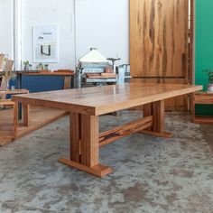 a large wooden table sitting inside of a room