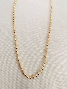 Chain Length: 20", 24" Chain Width: 3mm About Gold Filled Jewelry:What is gold-filled? We carry gold filled jewelry that is composed of a solid layer of 18kt gold, that is bonded to a base metal. Gold Filled and vermeil jewelry are great quality alternatives to solid gold. With proper care and storage, you will have jewelry that will last a lifetime. Tips to make your jewelry last:1. Keep it dry. Store your jewelry in the plastic bag included in your purchase.2. Avoid harsh chemicals such as per 14k Gold Ball Chain Necklace, Gold Box Chain Necklace With Round Beads, Gold Necklace With Box Chain And Round Beads, Everyday Gold Ball Chain Necklace, Gold Necklace Women, Vermeil Jewelry, Gold Filled Earrings, Chain Anklet, Pendant Bracelet