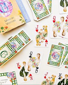 playing cards are laid out next to each other on a white surface with green and red designs