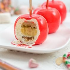 two pieces of food on a plate with toothpicks sticking out of the top