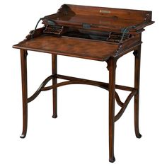 an antique wooden writing desk with leather top and drawer on one side, in the shape of a briefcase