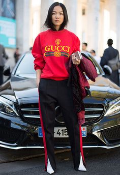 If you were worried about how to make a track-style trouser look luxe, consider this your deep breathing exercise. Influencer Yoyo Cao added premium status to her relaxed look with a tucked in 'do and pointed white boots (it's the little things, you know?) Gucci Sweatshirt, Gucci Sweater, Gucci Outfits, Paris Fashion Week Street Style, Moda Chic, Gucci Fashion, Spring Street Style