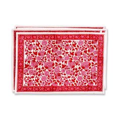 a red and white bandanna with floral designs on the border, in front of a white background