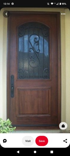 a wooden door with wrought iron designs on it