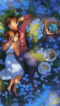 a man and woman are dancing in the grass with blue flowers around them on their backs