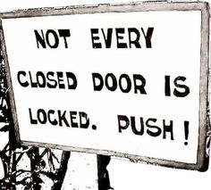 a sign that says not every closed door is locked, push