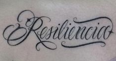 a tattoo with the word resilicino written in cursive writing on it