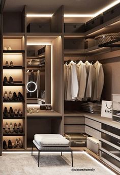 a walk in closet filled with lots of shoes