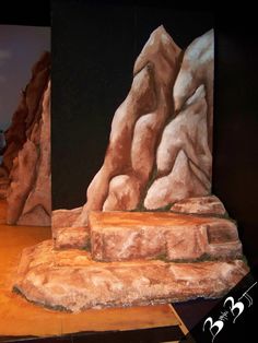 an artistic painting of rocks and boulders on display