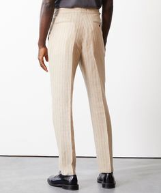 Everyone’s closet needs the perfect pair of trousers. These certainly fit the bill, crafted from handsome Italian linen from Sondrio Mill: a soft cream base with a refined charcoal pinstripe (think vacationing in the Mediterranean vibes). The silhouette has just enough on-trend fullness, falling straight through the le Linen Trousers Men, Mediterranean Vibes, White Dress Pants, Closet Needs, Soft Tailoring, Cream Base, Party Pants, Linen Suit, Linen Shop