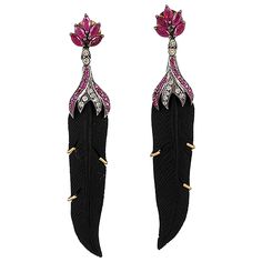 These stunning hand carved Jade earrings are crafted in 18-karat gold and sterling silver. It is set in 9.6 carats Jade, 2.22 carats ruby and .45 carats of sparkling diamonds. FOLLOW MEGHNA JEWELS storefront to view the latest collection & exclusive pieces. Meghna Jewels is proudly rated as a Top Seller on 1stDibs with 5 star customer reviews. All items manufactured by us are handmade and can be customized or redesigned. Composition Size-75X13 MM Total Weight-11.594 Gold Weight(Gms)-2.83 Silver Luxury Carved Black Jewelry, Carved Jade, Jade Earrings, Cubic Zirconia Earrings, Jade Carving, Zirconia Earrings, Jade Jewelry, Black Feathers, Top Seller