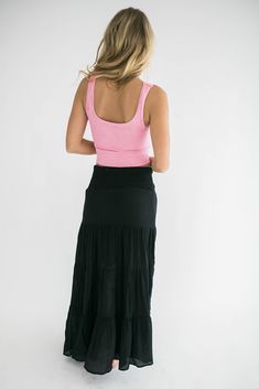 Our Georgia tank sets the foundation for any outfit! It is figure flattering and provides the ultimate level of stylish comfort. So easy to layer and also amazing on its own. Pair it with our Alara maxi skirt for running errands or with biker shorts and an oversized blazer for brunch with friends. Trust us this will be a wardrobe staple! Features: scoop neck front and back neckline ribbed knit fabrication perfect amount of stretch one size fits most fabric content : 92% nylon : 8% spandex