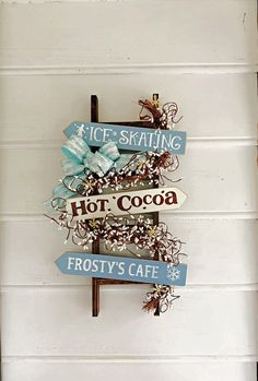 there is a sign that says hot cocoa and frosty's cafe on it