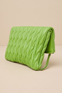 The trendiest 'fit deserves the most fashion-forward finishing touch, like the Urban Expressions Demeter Lime Green Vegan Leather Quilted Clutch! Smooth vegan leather shapes this puffy, quilted-style clutch that features a classic foldover silhouette with hidden magnetic closures that open to reveal a roomy outer pouch. Unzip the top to access an interior compartment with a sidewall zippered pocket and two bonus sidewall slots. Carry as a chic clutch or attach the removable gold chain strap for a crossbody look! Clutch measures 11" wide, 8" tall, and 1" deep. Detachable 51. 5" gold chain strap. Chain strap has a 23. 5" drop. Lined. Shell: Polyutherane. Lining: Polyester. Do Not Wash. Imported. Lulus | Demeter Lime Green Vegan Leather Quilted Clutch | Vegan Friendly. Green Clutch Box Bag With Detachable Strap, Summer Green Rectangular Clutch, Green Zipper Clutch Wallet, Green Clutch With Zipper Closure, Green Rectangular Leather Clutch, Vegan Handbags, Casual Wedding Dress, Purse Accessories, Spring Shoes