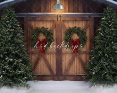 two christmas wreaths on the front of a wooden door