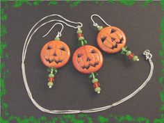 "@@ FREE SHIPPING WITHIN USA @@ LIMITED EDITION GREEN CRYSTALS - ONLY 4 Sets Created - Happy Halloween - Jack O Lantern Pumpkin Sterling Silver Pendant Necklace & Earrings - Orange & Green Swarovski Crystals. What A Sweet Set For Halloween. This handsome Set was created with Large Carved Stone Orange Jack O Lantern Beads and accented with Orange & Green Swarovski Crystals, Green Sea Glass Beads & Sterling Silver Wire. The Scary Pendant measures 1\" x 2 1/2\" and hangs on a Sterli Green Halloween Party Jewelry, Green Halloween Dangle Earrings, Orange Jack O Lantern, Crystals Green, Jack O Lantern Pumpkin, Pumpkin Necklace, Orange Amp, Halloween Necklace, Halloween Jack O Lanterns