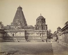 an old black and white photo of a temple