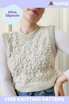 a woman wearing a knitted sweater with the text free knitting pattern