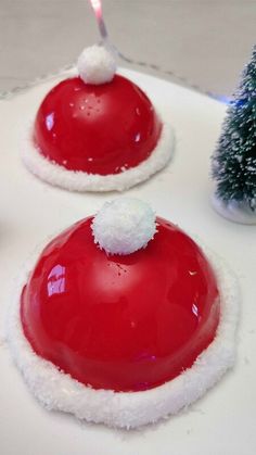 two red and white christmas desserts on a plate