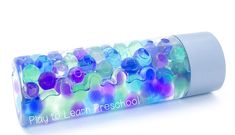 a tube filled with lots of different colored beads