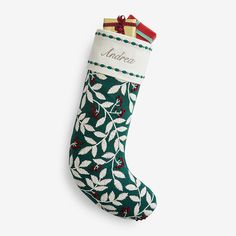 a christmas stocking with holly leaves on it