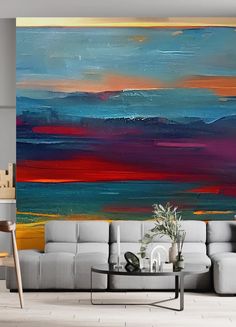 an abstract painting on the wall in a living room