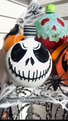 halloween ornaments are displayed on a shelf