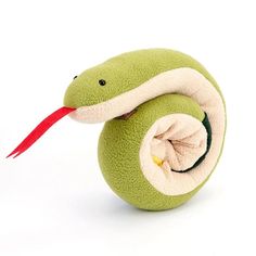 a green stuffed snake with a red tail