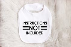 Instructions Not Included Baby Bib makes a funny baby gift. We all know that even the sweetest baby will have moments. This is a great baby shower gift. It's sure to get lots of laughs and get everyone mingling.  Includes:  * 1 velcro back bib (your color choice) with "Instructions Not Included" made in your color choice of htv.  *Please Note: Colored Bibs and or Bodysuits do cost a little more * Nicely packaged in a cellophane bag. Ready to gift  Grab a matching bodysuit to complete your gift. Instructions Not Included, Onesie Station, Funny Bibs, Newborn Bibs, Funny Baby Gifts, Baby Shower Prizes, Mommy To Bee