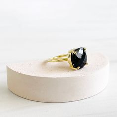 Classic and wearable, this stunning ring will definitely make a statement. Also available in other gemstones GEMSTONE: Onyx STONE SIZE: 12mm x 12mm RING SIZE: Adjustable MATERIAL: gold/silver plated brass Gold Onyx Rings For Wedding, Gold Onyx Wedding Rings, Adjustable Gold Onyx Ring, Gold Onyx Ring Perfect As A Gift, Gold Onyx Ring As A Gift, Gold Onyx Ring Perfect For Gifts, Gold Promise Ring With Large Stone, Adjustable Gold Crystal Ring With Large Stone, Gold Crystal Ring With Large Stone For Promise