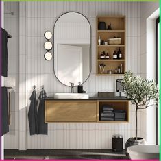 a bathroom with a sink, mirror and shelves on the wall next to each other