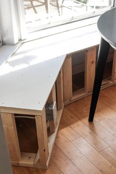 a table and some cabinets in a room