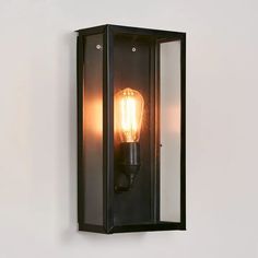 an outdoor wall light with a bulb on it