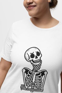 Get into the spooky spirit with this fun and quirky skeleton T-shirt! Featuring a playful skeleton graphic, this shirt is perfect for Halloween or anytime you want to show off your spooky side. The design combines a vintage aesthetic with a modern twist, making it a versatile addition to any wardrobe. Whether you're attending a Halloween party or simply love skeletons, this unisex shirt is sure to get some smiles. Available in various sizes, it's a great gift for Halloween lovers or anyone who appreciates sarcastic humor. We utilize the authentic Bella Canvas 3001 brand, renowned for its UNISEX design, making it one of the most sought-after shirts in the market. Prior to placing an order, kindly refer to our size chart. It can be located in both the listing's images and description. This c Halloween T-shirt With Skull Front Print, Vintage Shirt Design, Halloween Fan Merchandise T-shirt With Skull Print, Skeleton Graphic, Cheap Spooky Skull Print T-shirt, Halloween Skull Print Crew Neck T-shirt, Spooky Cotton T-shirt With Skull Print, Skull Graphic, Funny Skeleton