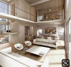 a living room filled with white furniture next to a tall wooden stair case in front of a window