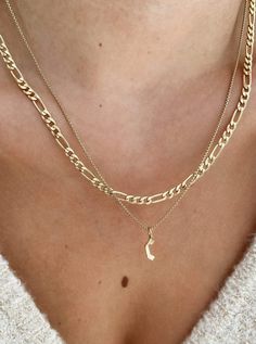 Our Figaro chain is an oldie but a goodie. Perfect for layering or wearing solo, it will never go out of style. Made to last in 14k Gold-Filled for everyday wear.  Measurements: 3.5mm Figaro Chain Length: Adjustable with a 2 inch extender chain Waterproof & tarnish resistant Staple Jewelry Pieces, Gold Figaro Chain, Figaro Necklace, Figaro Chain Necklace, Clothing Optional, Stacked Necklaces, White Gold Chains, Figaro Chains, Figaro Chain