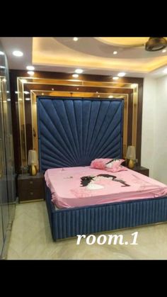 a bed with pink sheets and pillows in a room