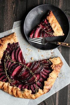 a slice of beet pie on a table with a fork