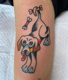 a dog with a bone in it's mouth is shown on the arm and leg