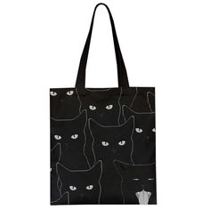 a black tote bag with white cats on the front and bottom, all over