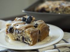 a slice of blueberry coffee cake on a plate