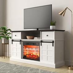 an entertainment center with a fireplace in the middle