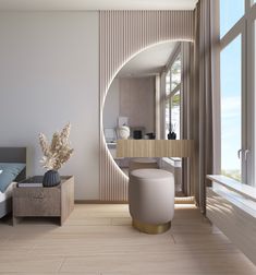 a large round mirror in the middle of a room with a couch and table next to it