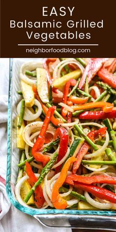 a glass casserole dish filled with pasta and vegetables