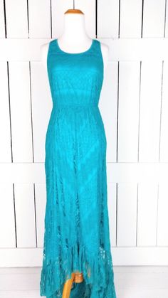 "Stretch lace sleeveless maxi dress/vintage 90s high/low pullover long lace ruffle dress/juniors small Measurements...taken flat -marked size: juniors small -across bust: 16\" -across waist: 12\"-15\" -across hip: 18\" -shortest length: 45\" -longest length: 57\" Features... -pretty soft stretch lace overlay -stretch polyester lining -pullover style -high low ruffle lace hemline - Solitaire Condition... -excellent vintage condition -gently worn AA3130*" Fitted Lace Maxi Dress With Lace Bodice, Fitted Lace Dress With Maxi Length Bodice, Summer Midi Dress With Lace Back, Fitted Lace Bodice Maxi Length Dress, Fitted Lace Maxi Dress With Scalloped Details, Fitted Lace Maxi Dress With Scalloped Lace, Casual Maxi Dress With Lace Patchwork, Fitted Maxi Length Lace Dress With Scalloped Lace, Fitted Lace Patchwork Dress For Summer